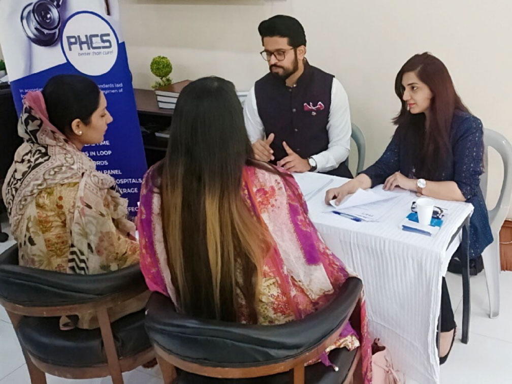 PHCS team discussing preventive health with parents