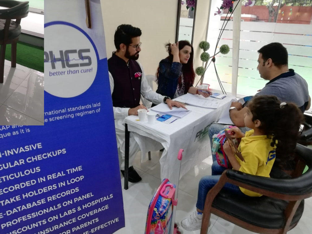 Parent and child meeting with the PHCS team