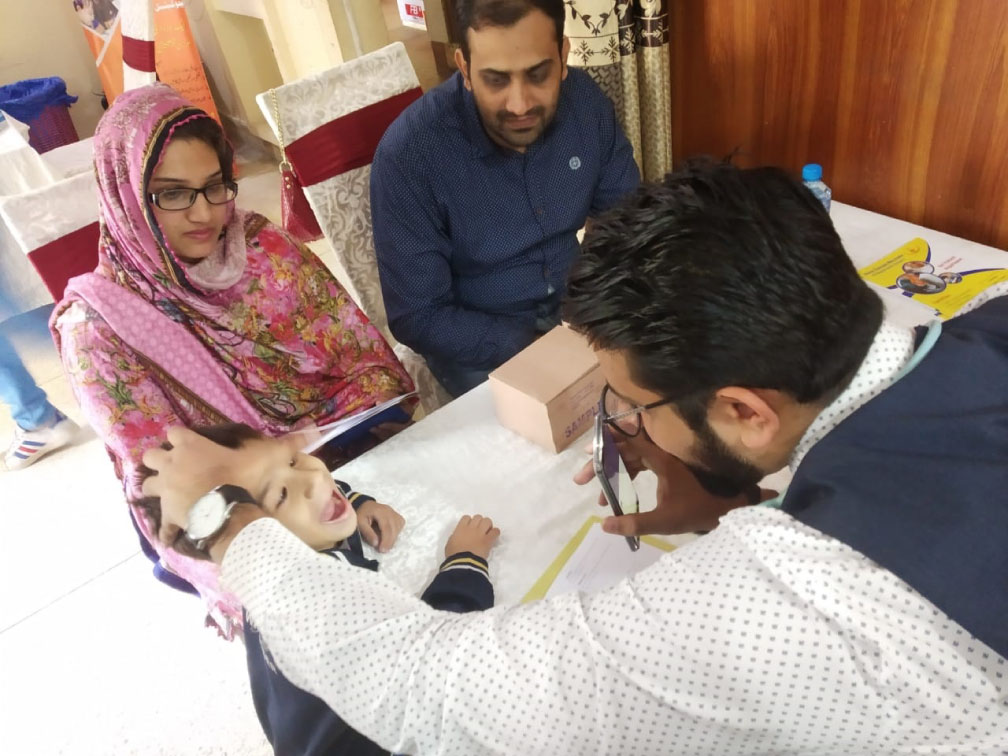 Child receiving a clinical examination