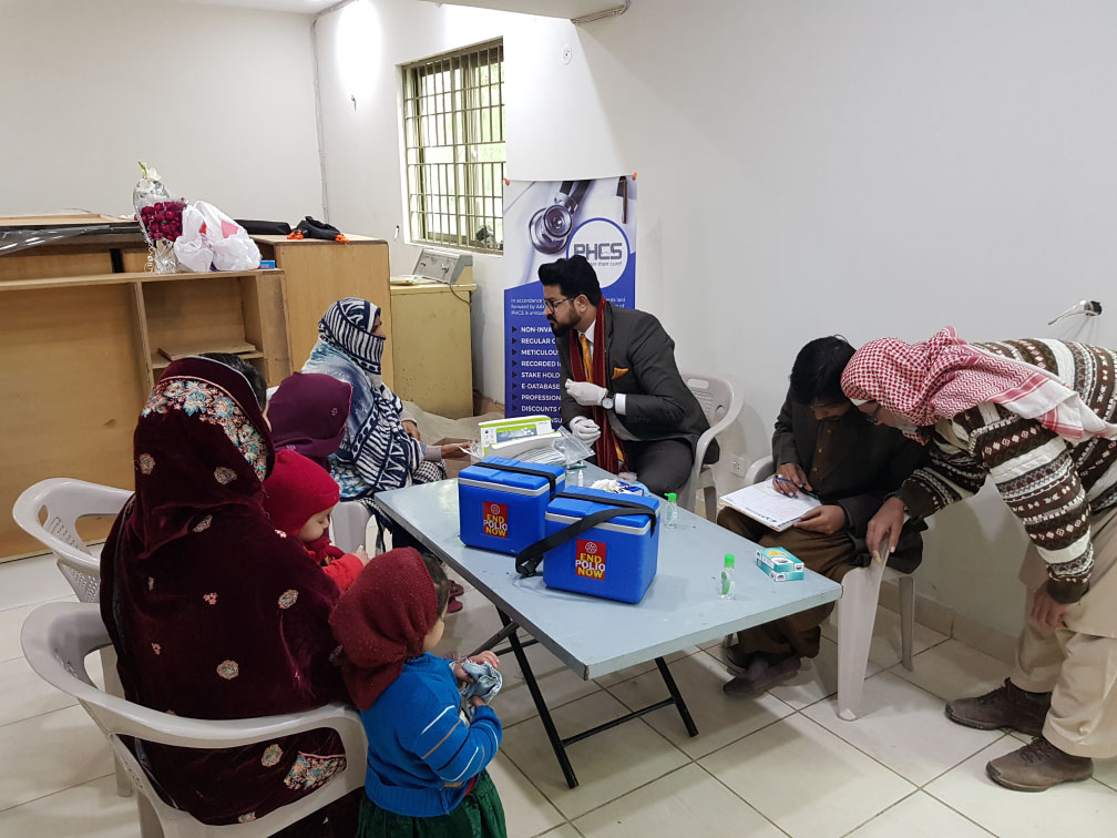 Screening team consulting with community members